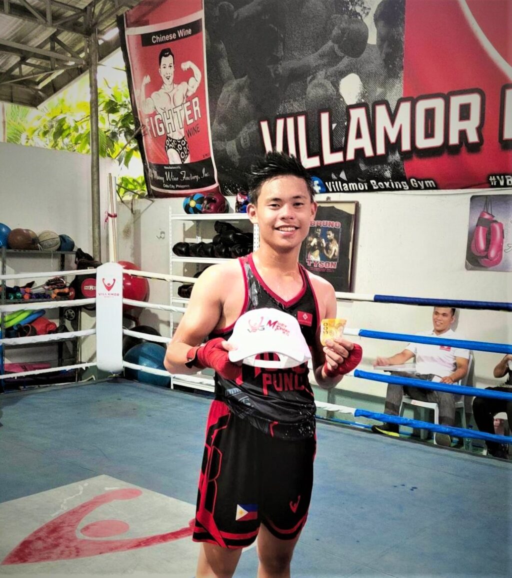 AJ ALA Villamor poses for the camera after winning his bout in the  VBG Amateur Boxing Monthly Grassroots Program in Barangay Pagsabungan, Mandaue City, last Sunday.