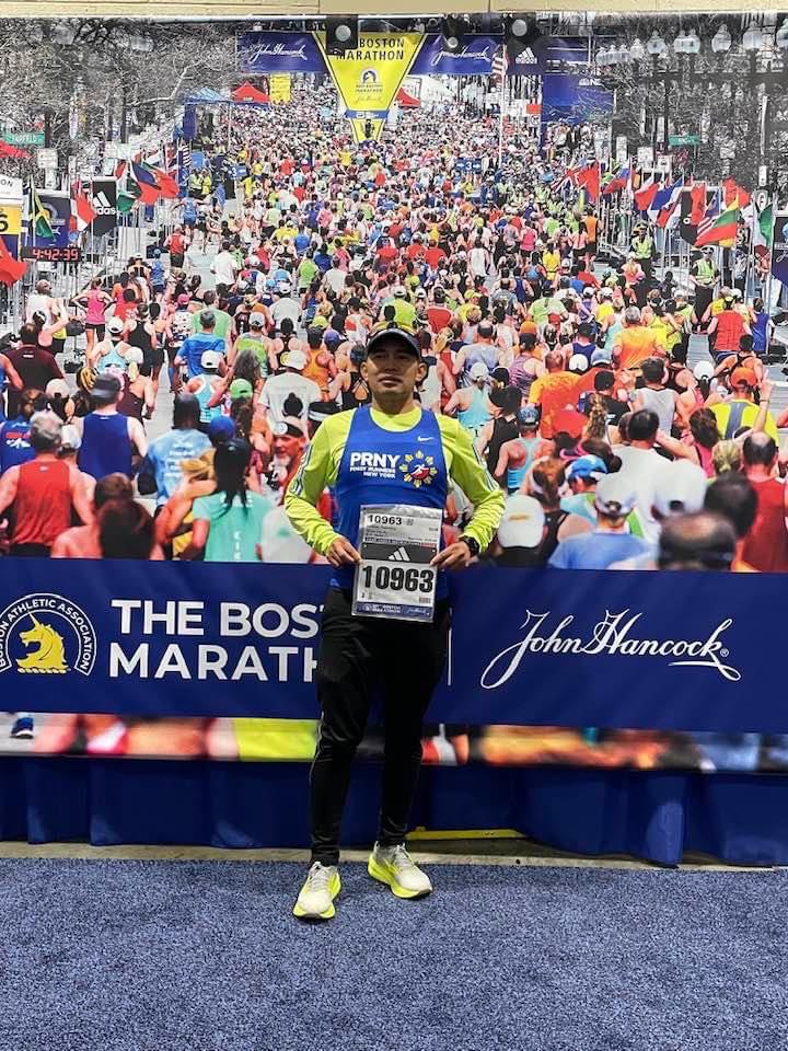 Segundino Cardines pose with his race number during the Boston Marathon in the United States.