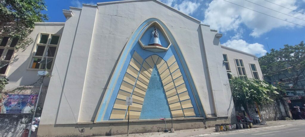 An image of the Nuestra Señora de Regla is at the top of the wall of the back of the church in Lapu-Lapu City, facing the sea. | Futch Anthony Inso