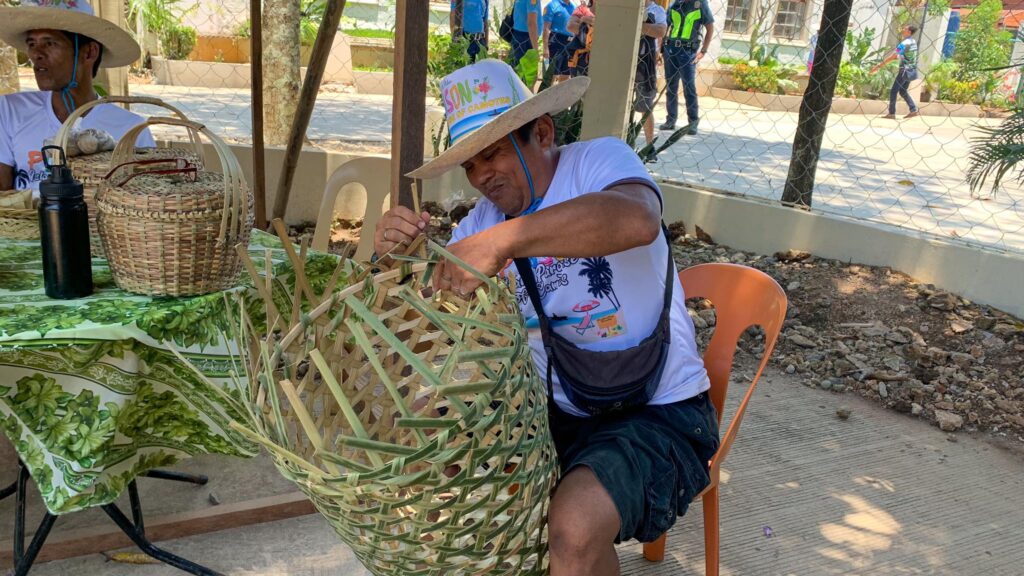 Fedelito Tebas, a basket maker, shows how to make one of his baskets during the Suroy Suroy on Camotes Island. | Wenilyn Sabalo