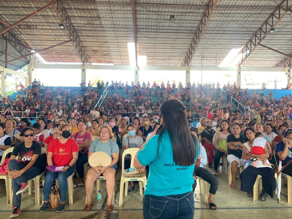 Some 1,500 Oponganons or residents of Lapu-Lapu City are briefed inside a gym in the city before they will start their 10-day work.