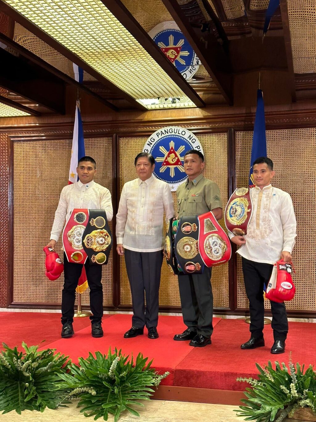 New Filipino boxing champions pay a courtesy call to President Ferdinand Marcos Jr. (second from left) at the Malacañang Palace. They are Marlon Tapales (from left) Charly Suarez, and Melvin Jerusalem.