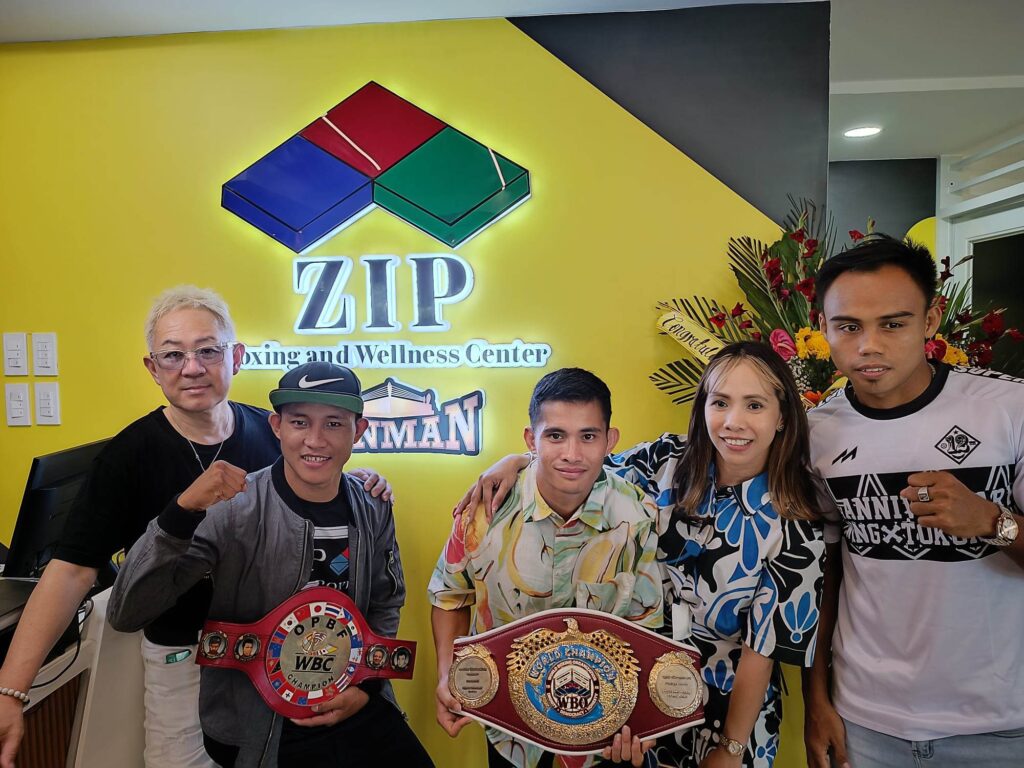  Noboyuki Matsuura, (from left) Kevin Jake Cataraja, Melvin Jerusalem, Marivic Matsuura, and Jeo Santisima of ZIP Sanman Boxing Team take time to pose for a photo opportunity during the opening of the ZIP Boxing and Wellness Center. | Glendale Rosal