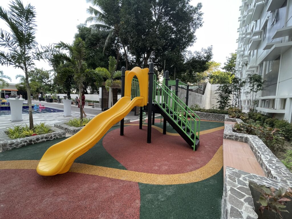 children's slide at the newly completed amenity deck of Symfoni Nichols by Taft Properties