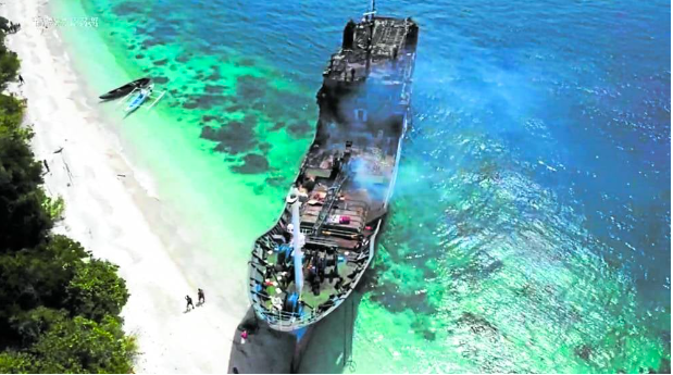 SEA TRAGEDY The burnt passenger ferry MV Lady Mary Joy 3 after it was run aground on Baluk-Baluk Island off Basilan province. —AFP