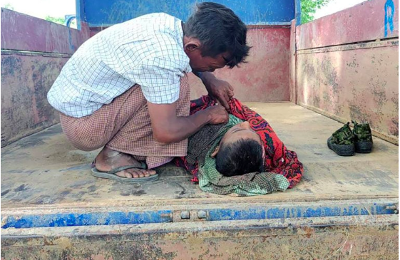 This photo taken on September 17, 2022 shows a young victim of an air strike on a school building in Depeyin township in Myanmar’s northwest Sagaing region, a day after an attack on the village by a Myanmar military helicopter. At least 11 schoolchildren died in an air strike and firing on a Myanmar village, the UN children’s agency said, an attack the country’s junta said targeted rebels hiding in the area. (Photo by AFP) / GRAPHIC CONTENT