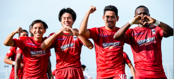 Players of Cebu Football Club (CFC) Gentle Giants, who are wearing their red football uniforms, celebrate after scoring a goal in one of their Philippine Football League games.