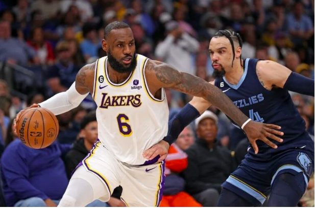 LeBron James #6 of the Los Angeles Lakers handles the ball against Dillon Brooks #24 of the Memphis Grizzlies during the first half of Game One of the Western Conference First Round Playoffs at FedExForum on April 16, 2023 in Memphis, Tennessee. Justin Ford/Getty Images/AFP 