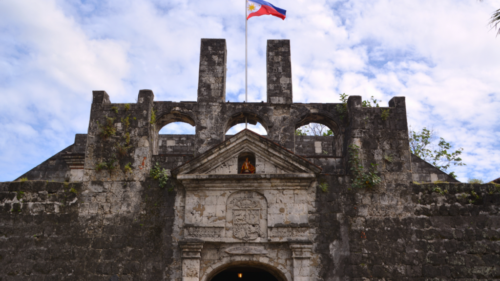 Fort San Pedro on a clear day with Philippine flag hoisted
