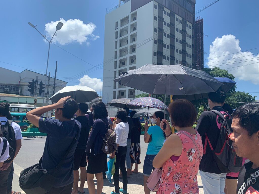 More hot days ahead as el Niño looms in the corner -- Pagasa. Photo shows pedestrians in downtown Cebu City using umbrellas to shield them from the afternoon heat.