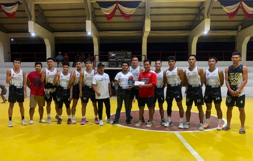 The Villaba Wings, the champions in the inaugural  Mayor Bebot Veloso Under-21 Intertown Basketball Tournament,  pose for a group photo during the awarding ceremony.