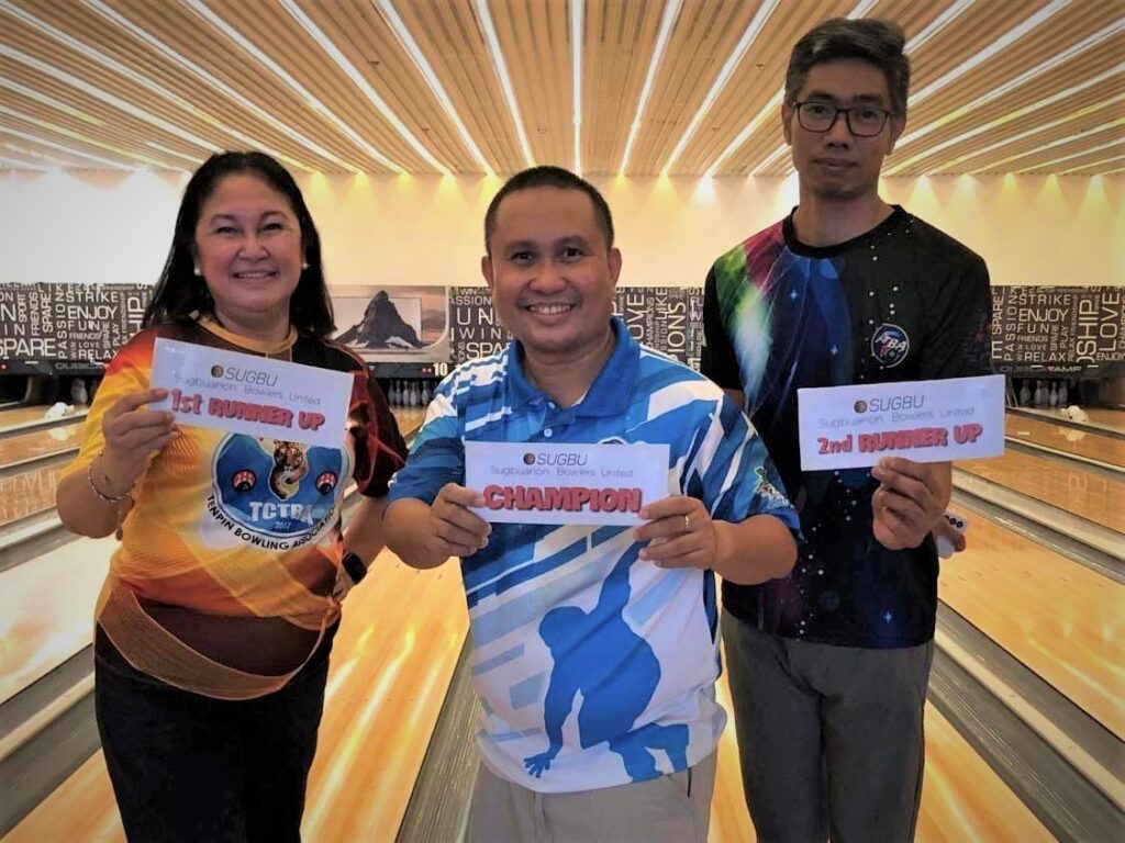 Tess Regino, Rey Velarde, and Luke Bolongan pose for a group photo during the awarding of the SUGBU Bowling Shootout Tournament. 