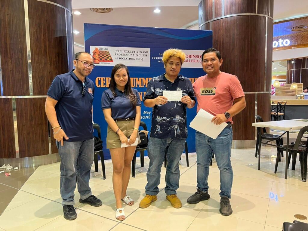 Rommel Ganzon (second from right) poses with CEPCA president, Engr. Jerry Maratas, (right most) and CEPCA officials during the awarding of the CEPCA Summer Open Chess Tournament at the Robinsons Galleria Cebu.