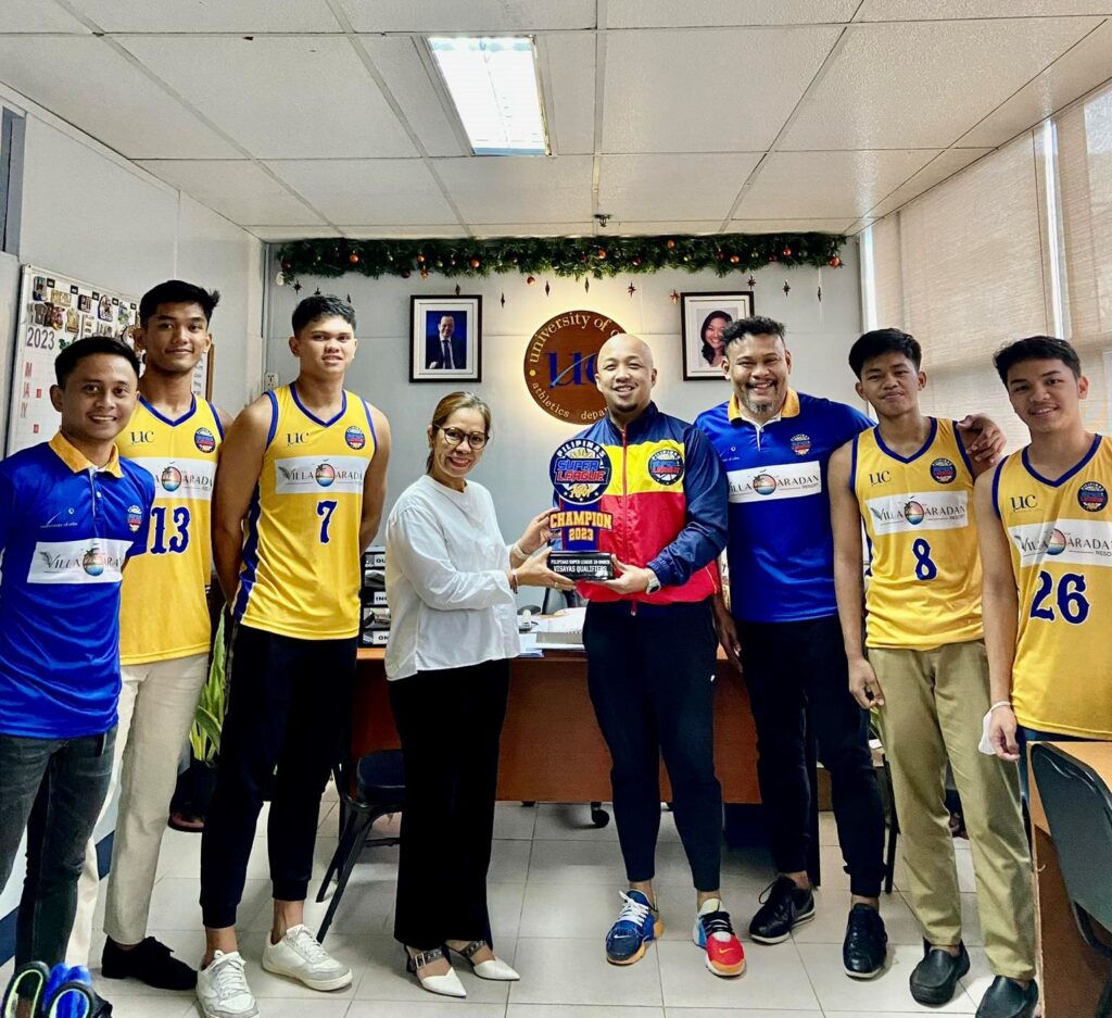 UC Baby Webmasters: Skip PSL 18-U Visayas leg, focus on studies instead. In photo is PSL 18-U tournament official Paul Joven (fourth from right) holding the champion's trophy along with UC Webmasters athletic director Jessica Honoridez (fourth from left) during a simple turnover ceremony. Joining them was UC Baby Webmasters head coach Jover Samonte (third from right) and his players. | Contributed photo