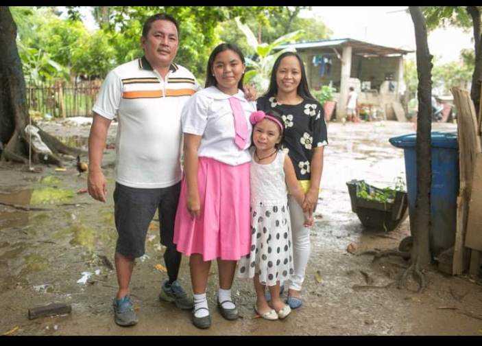 A PWD athlete and his devotion to St. Joseph. In photo is Owen Loceño (left) and his family. 