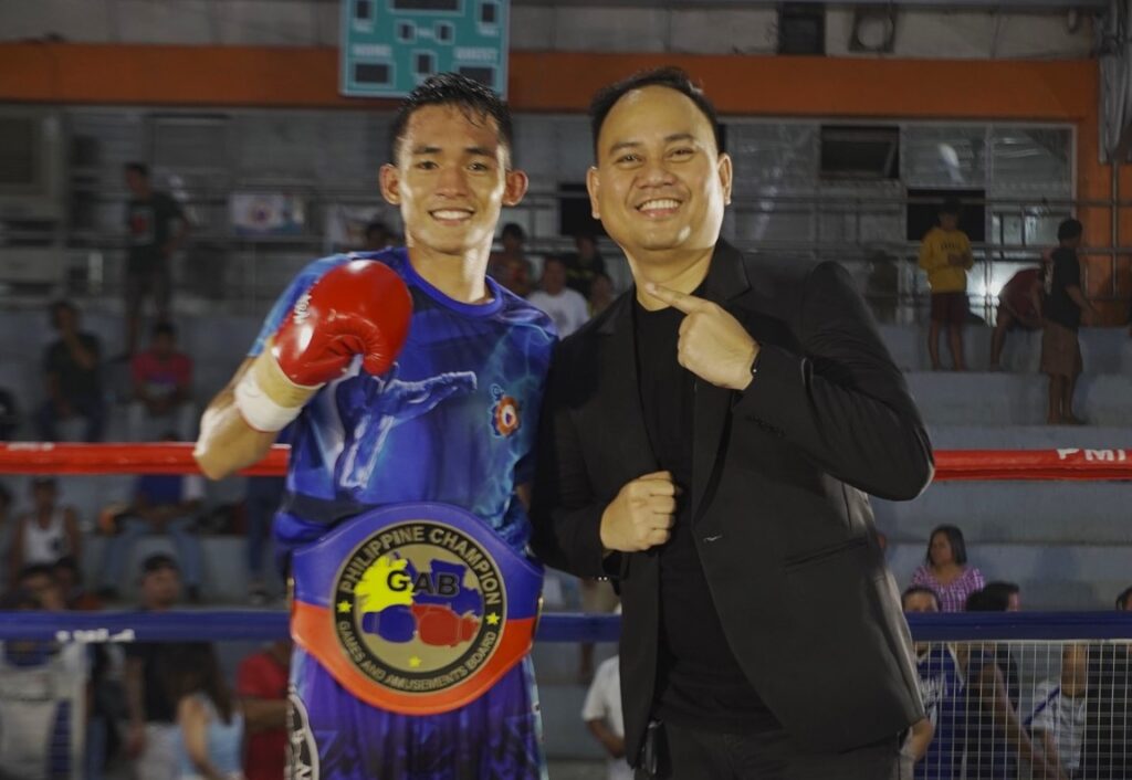 Jake Amparo poses with his promoter and manager Floriezyl Echavez Podot of the PMI Bohol Boxing Stable. | Photo from PMI Bohol Boxing Stable