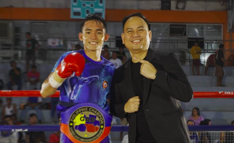 Jake Amparo poses with his promoter and manager Floriezyl Echavez Podot of the PMI Bohol Boxing Stable. | Photo from PMI Bohol Boxing Stable