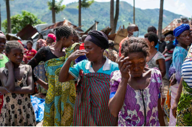 Congolese women react after the death of their family members following rains that destroyed buildings and forced aid workers to gather mud-clad corpses into piles in the village of Nyamukubi, Kalehe territory in South Kivu province of the Democratic Republic of Congo, May 6, 2023. REUTERS/Stringer