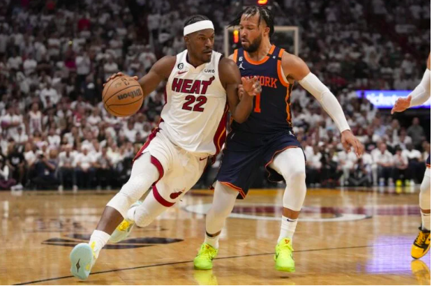 Jimmy Butler #22 of the Miami Heat drives past Jalen Brunson #11 of the New York Knicks during game three of the Eastern Conference Semifinals at Kaseya Center on May 06, 2023 in Miami, Florida. Eric Espada/Getty Images/AFP
