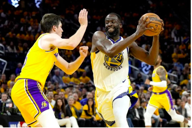 Draymond Green #23 of the Golden State Warriors drives to the basket against Austin Reaves #15 of the Los Angeles Lakers during the third quarter in game five of the Western Conference Semifinal Playoffs at Chase Center on May 10, 2023 in San Francisco, California. Thearon W. Henderson/Getty Images/AFP