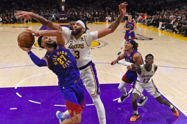 Jamal Murray #27 of the Denver Nuggets shoots the ball against Anthony Davis #3 of the Los Angeles Lakers in game three of the Western Conference Finals at Crypto.com Arena on May 20, 2023 in Los Angeles, California. Kevork Djansezian/Getty Images/AFP