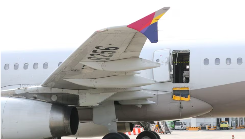 South Korea detains passenger after Asiana plane door opened mid-air. In photo is the Asiana Airlines' Airbus A321 plane, of which a passenger opened a door on a flight shortly before the aircraft landed, which is pictured at an airport in Daegu, South Korea May 26, 2023. Yonhap via REUTERS