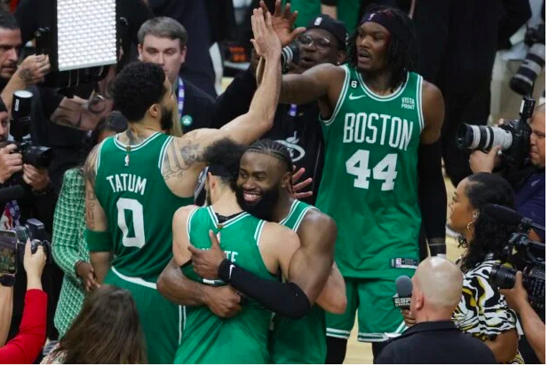 Derrick White #9 and Jaylen Brown #7 of the Boston Celtics react after defeating the Miami Heat 104-103 in game six of the Eastern Conference Finals at Kaseya Center on May 27, 2023 in Miami, Florida. Megan Briggs/Getty Images/AFP