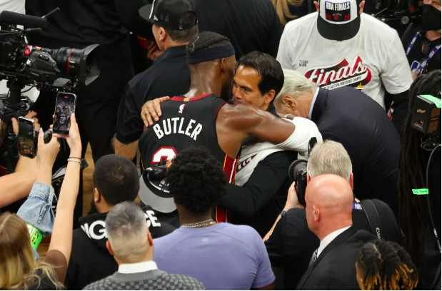 Jimmy Butler #22 of the Miami Heat hugs head coach Erik Spoelstra after defeating the Boston Celtics 103-84 in game seven of the Eastern Conference Finals at TD Garden on May 29, 2023 in Boston, Massachusetts. Adam Glanzman/Getty Images/AFP 