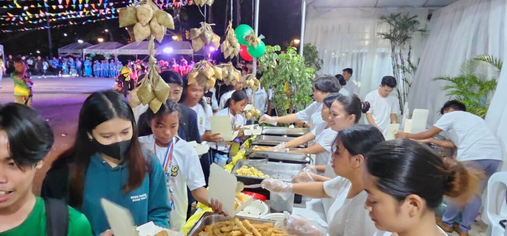 Athletes queue in line to get food during the "Barrio Fiesta" themed closing ceremony of the Palarong Pambansa Pre-National Qualifying Meet (PNQM) Cluster 3 held at the Ecotech Center in Lahug, on Saturday, June 17, 2023. 