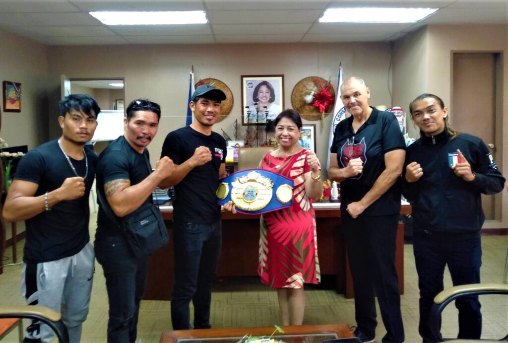 WBF Australasian super light weight champion Elmo Traya (third from left) and Money Punch Fight Promotions CEO Christian Faust (second from right) flanks Consolacion Mayor Teresa P. Alegado during their courtesy visit on Monday, June 26, 2023. Joining them are Money Punch trainers.