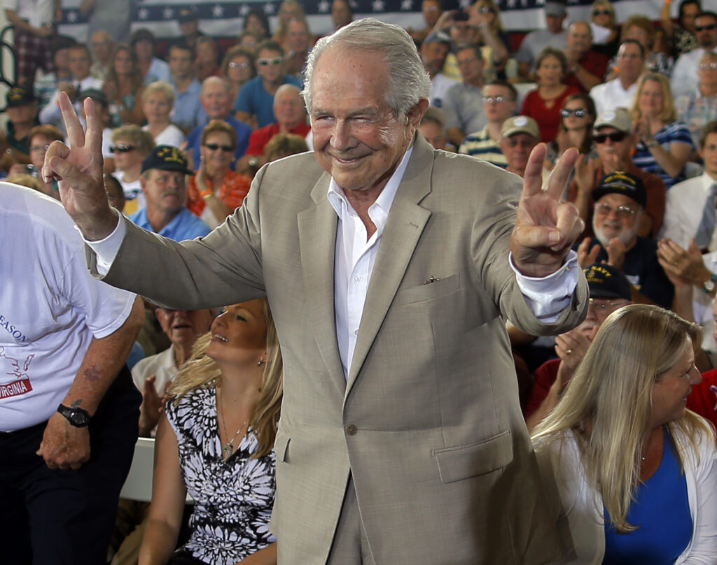 FILE PHOTO: Evangelical Christian leader Pat Robertson takes his seat onstage ahead of a campaign rally with Republican presidential candidate and former Massachusetts Governor Mitt Romney in Virginia Beach, Virginia September 8, 2012. REUTERS/Brian Snyder