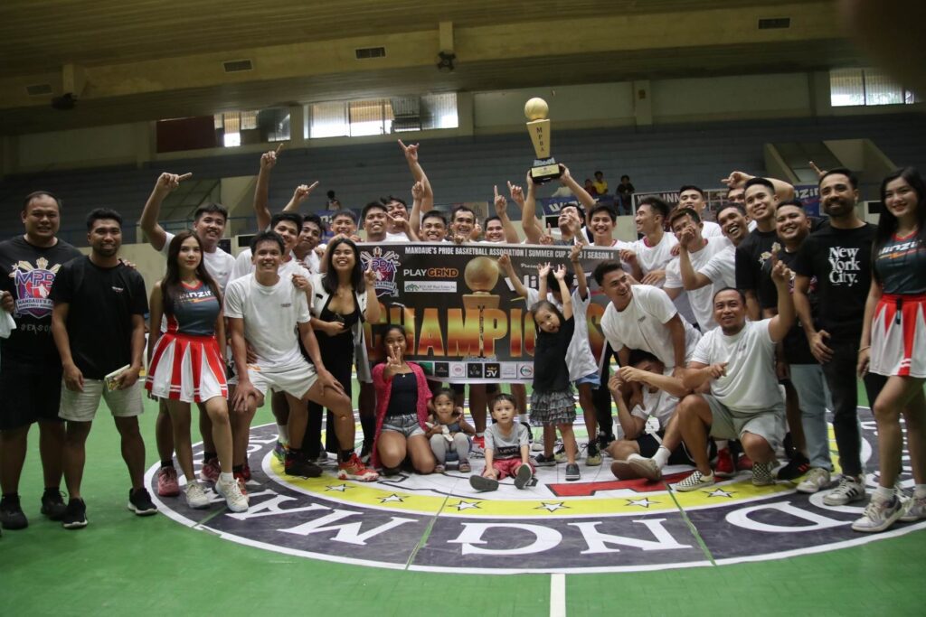 Truck N Trail players and team officials gather at center court to celebrate their title-winning game against ARQ Builders in the MPBA Summer Cup at the Mandaue City Sports Complex. Joining them is MPBA commissioner Fritz Eduard Malinao (leftmost), tournament organizers, and sponsors. | Contributed photo