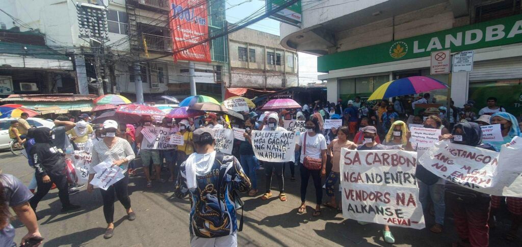 Members of the Carbonhanong Alyansa sa mga Mamumuo held a protest on Wednesday, June 14, against a plan to make the Carbon Night Market vehicle-free.