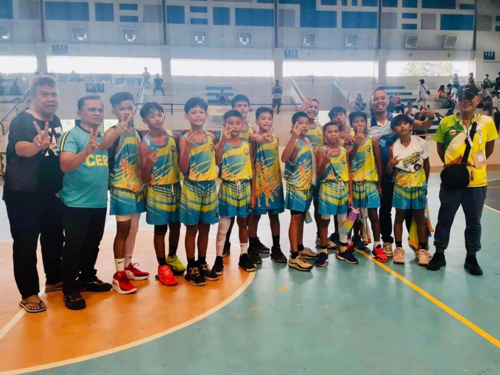 The Minglanilla Central School elementary boys basketball team celebrates as the team cruise to two lopsided wins and will represent CVIRAA in the Palarong Pambansa in Marikina this July. | Photo from the re-National Qualifying Meet Facebook page
