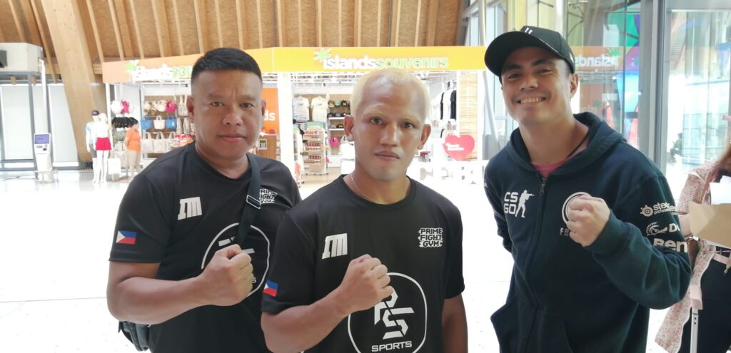 Melindo flies to South Korea for July 1 title defense against Korean boxer. Milan Melindo (middle) poses with Prime Stag Sports officials before flying to South Korea for his first title defense. | Photo from Prime Stag Sports.