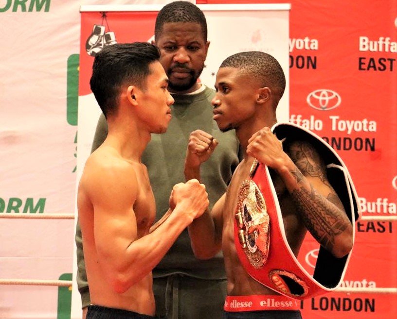 Regie Suganob (left) and Sivenathi Nontshinga (right) engage in a fierce staredown during their weigh-in for their world title bout on July 2. | Photo from Rumble Africa Promotions