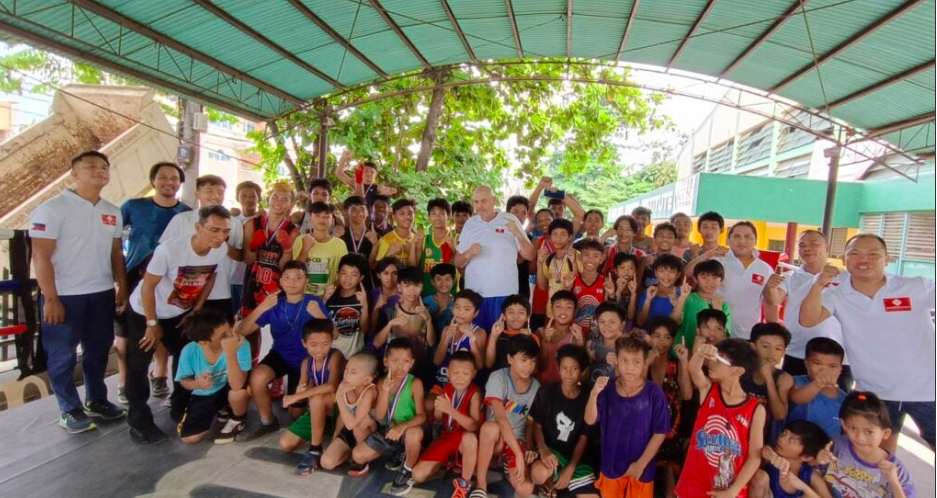 Cebu City Sports Commission's amateur grassroots boxing officials, participants, and Money Punch Fight Promotions Christian Faust (middle wearing white shirt) pose for a group photo during the monthly Cebu City Junior Olympics amateur boxing event. | Contributed photo