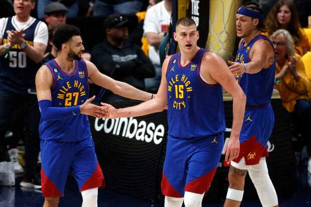 Jun 1, 2023; Denver, CO, USA; Denver Nuggets center Nikola Jokic (15) and guard Jamal Murray (27) celebrate during the second half against the Miami Heat in game one of the 2023 NBA Finals at Ball Arena. Mandatory Credit: Isaiah J. Downing-USA TODAY Sports