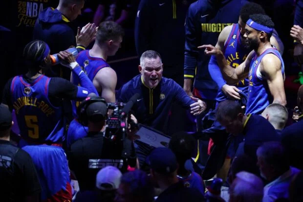 Head coach Michael Malone of the Denver Nuggets gives instructions during a timeout during the fourth quarter against the Miami Heat in Game One of the 2023 NBA Finals at Ball Arena on June 01, 2023 in Denver, Colorado.  Jamie Schwaberow/Getty Images/AFP