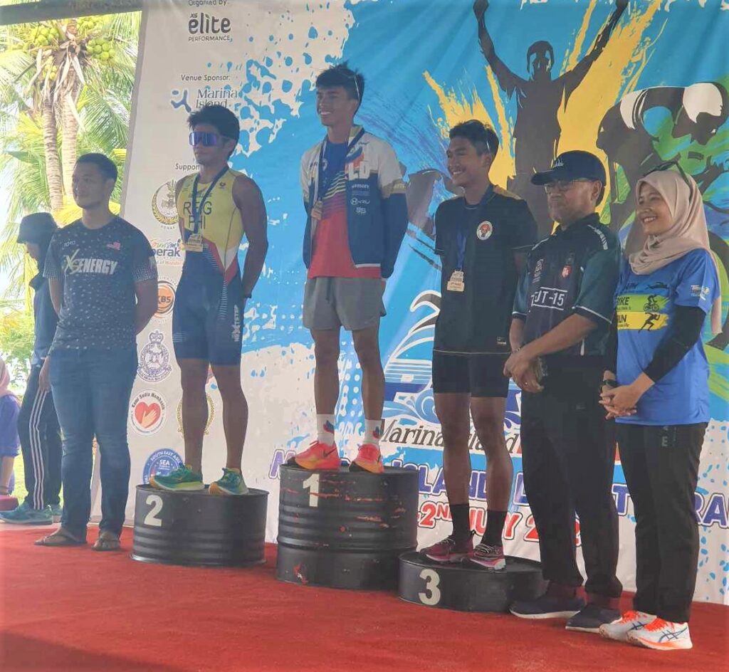 Andrew Kim Remolino (top of the podium) during the awarding of the Seata Perak Triathlon in Malaysia.