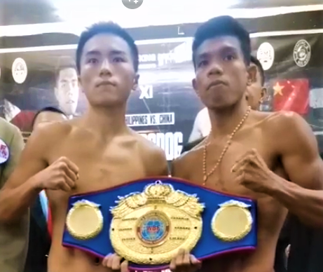 Angilou Dalogdog (right) and Long Yi Hu (left) strike a pose during the weigh-in for their WBF regional title bout in Tagbilaran City, Bohol on Friday, July 21, 2023.