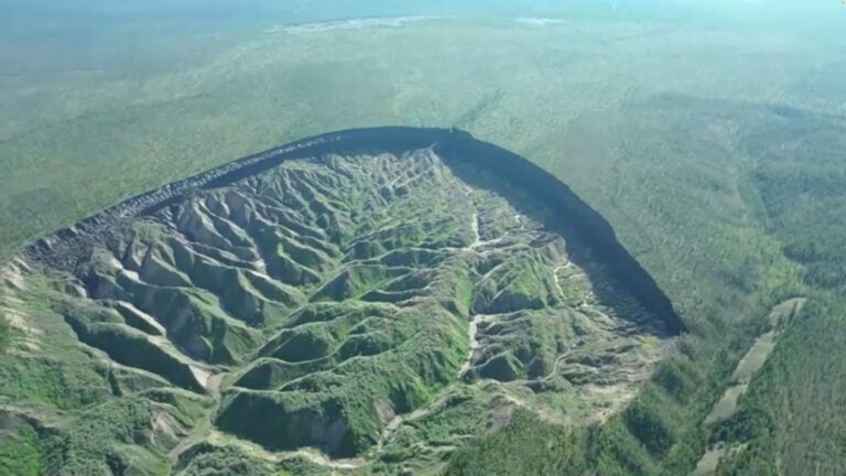 World’s biggest permafrost crater in Russia’s Far East thaws as planet warms. A view of the Batagaika crater, as permafrost thaws causing a mega slump in the eroding landscape, in Russia’s Sakha Republic in this still image from video taken July 11 or 12, 2023. Reuters TV via REUTERS
