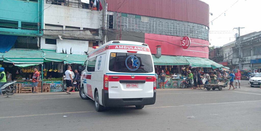 An ambulance is ready to bring the accident victim in front of Carbon Public Market this morning. | Paul Lauro