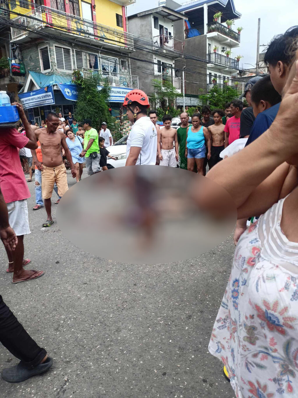 Backrider of a habal-habal, Jeraldyn Asentista of Barangay Labangon, Cebu City dies after she was ran over by a dump truck during a road accident at the corner of Imus Road and Lorega St. in Barangay Lorega San Miguel, Cebu City this morning. | Contributed photo via Paul Lauro 