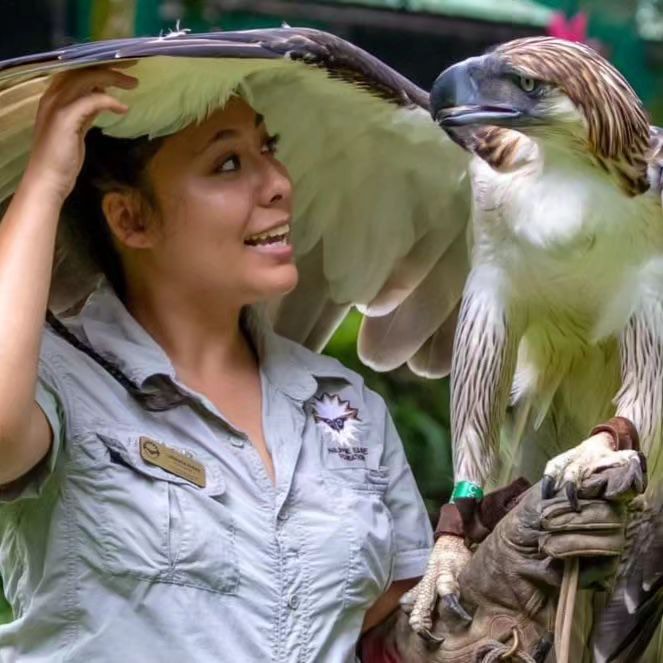 Philippine Eagle, and ambassador of his species, Sinag with his keeper, Lohwana Halaq, as they share friendly glances inside the premises of Philippine Eagle Center in Davao City. | Lohwana Halaq/ IG