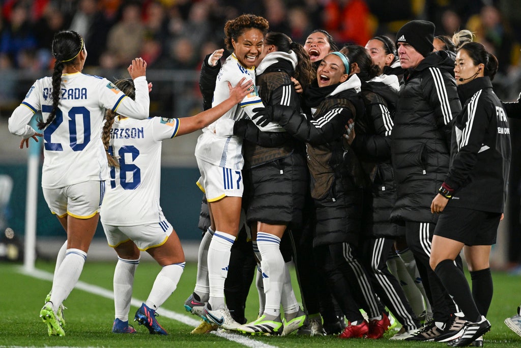 Philippines’ Sarina Bolden, center, is congratulated by teammates after scoring her team’s first goal during the Women’s World Cup Group A soccer match between New Zealand and the Philippines in Wellington, New Zealand, Tuesday, July 25, 2023. (AP Photo/Andrew Cornaga)