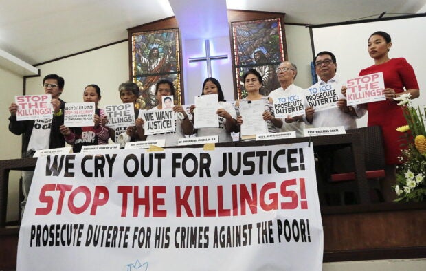CRY FOR JUSTICE | In this 2018 photo, leaders and supporters of Rise Up for Life and for Rights, a network of Church workers, human rights advocates, and relatives of victims of drug-related killings, air their appeal for justice for victims of then-President Rodrigo Duterte’s bloody war on drugs. (Photo by GRIG C. MONTEGRANDE / Philippine Daily Inquirer)