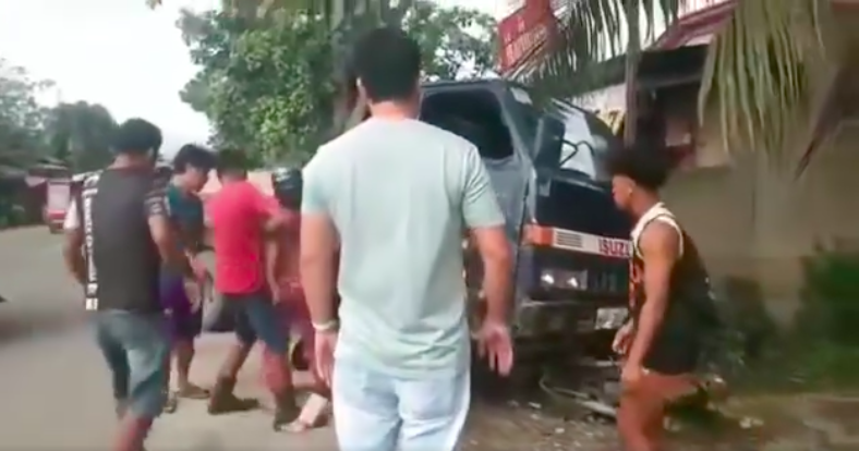 1 dead, 3 hurt in 2 road accidents in Balamban, Danao. Residents rush to the aid of a Jonesa Sorela, who was dragged with her motorcycle after a truck crashed into the motorcycle on Saturday morning in Balamban town in western Cebu. | screen grab from dyHP video via Paul Lauro