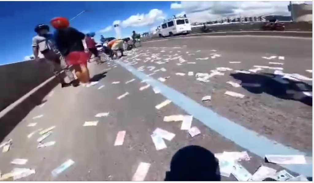 Cash scattered along the Cebu South Coastal Road at the SRP after a collector's bag opened while driving along the viaduct.