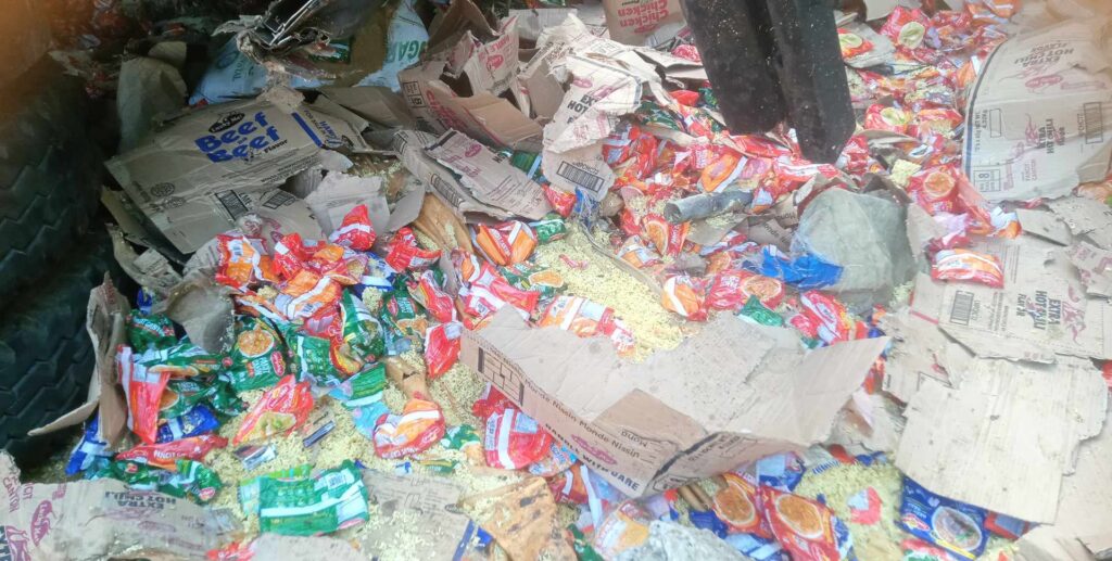 The truck that fell off a ravine in Tabogon town on Sunday, July 30, was carrying noodles and sacks of brown sugar. | Paul Lauro 